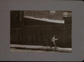 People Walking Against Building