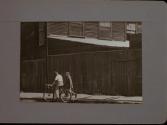 People Walking Against Building