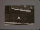 People Walking Against Building
