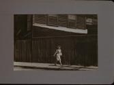People Walking Against Building