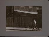People Walking Against Building