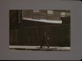 People Walking Against Building