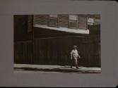 People Walking Against Building