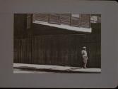 People Walking Against Building