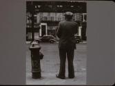 Man Standing by Fire Hydrant