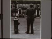 Man Standing by Fire Hydrant