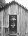 [Wood Shed with sculpture]