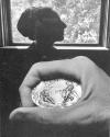 [Hand Holding Coin/Female Profile]
