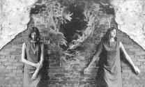 [Female Double Portrait Against Wall]