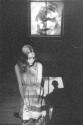 [Woman Kneeling Under Window]