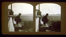 [Wallace Clendenen perched on ledge overlooking countryside, California]