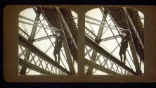 [Wally Clendenen standing on support beam of bridge]