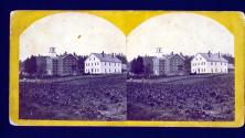 [Two buildings in landscape]