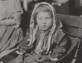 Italian child gets her first penny at Ellis Island - 1926