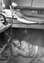 [Man Resting in Trailer-Circus Knie]