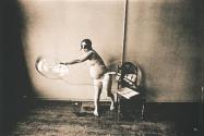 [Pregnant woman making large soap bubble]