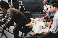 Rescue Bullets Wounded-A rickshaw driver fiercely paddled (sic) the wounded people with the help of bystanders to a nearby hospital Sunday. PLA soldiers again fired hundreds of rounds towards angry crowds outside Tiananmen Square at noon.