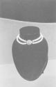 [Necklace in store window]
