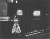 [Woman on street corner]