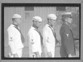 [Three Sailors with an Officer]