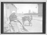 Old Woman Mending Bags In View Of The Cathedral Of Orleans France