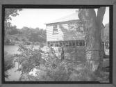 [ARC Woman with Flood Victim by River]