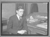 [Man at a Desk]