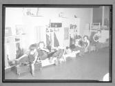 [Children Sitting on Benches]