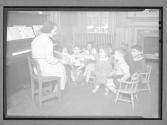 [Teacher Reading to Class]