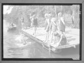 [Boys Swimming by Dock]
