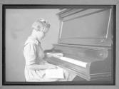 [Blind Girl Playing Piano]