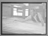 [Man with Loom]