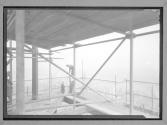 Men on Pipe Structure