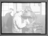 [Two Men With Forge]