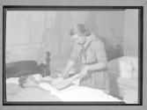 [Girl Scout with patient]