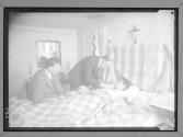 [Man in Bed Attended by Doctors]
