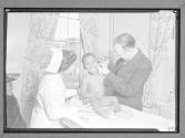 [Doctor and Nurse Examine Child]