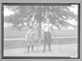 [Two Boys on Crutches]