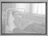 [Boy in Institutional Bed]