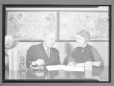 [Woman and Man in Conversation]