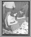 [Two Women Sewing]