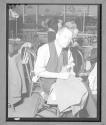 [Older Man Sewing]