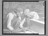 [Two Men with Torch]