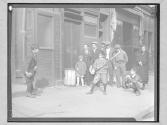 [Boys playing baseball in the street]