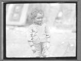 [Portrait of Child in Street]