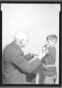 [Doctor Innoculating Boy]