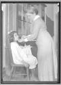 Nurse Examining Child
