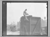[Brakeman on Freight Car]