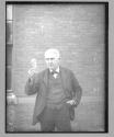 [Thomas Alvah Edison holding a lightbulb]