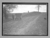 [man with auto in country]